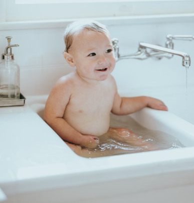 baby in a bathtub, sink