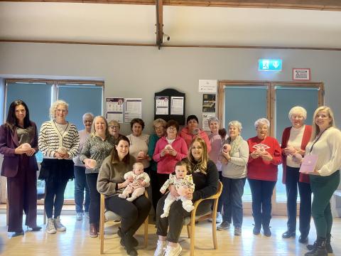 Pictured (L-R) Jenny Irvine, Chief Executive Officer at Arc Healthy Living Centre, Dr Hannah McCourt Senior Health and Social Wellbeing Improvement Officer at the PHA with members of the Knit and Natter Group and Nicola Burchmore, Infant Feeding Lead at Western Health and Social Care Trust.