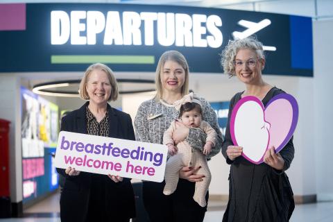 Picture of Paula Bittles, People and Purpose Executive at Belfast City Airport with local mum Janelle Clegg, baby Imogen and Dr Hannah McCourt, Health and Wellbeing Improvement Manager at the Public Health Agency. 