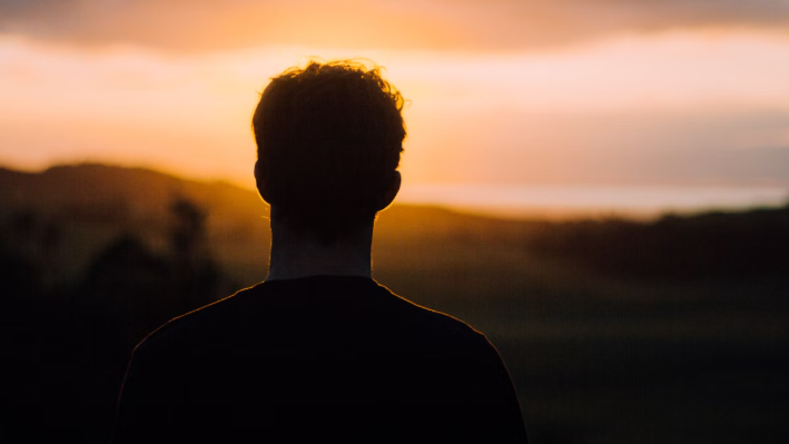 man looking into the horizon